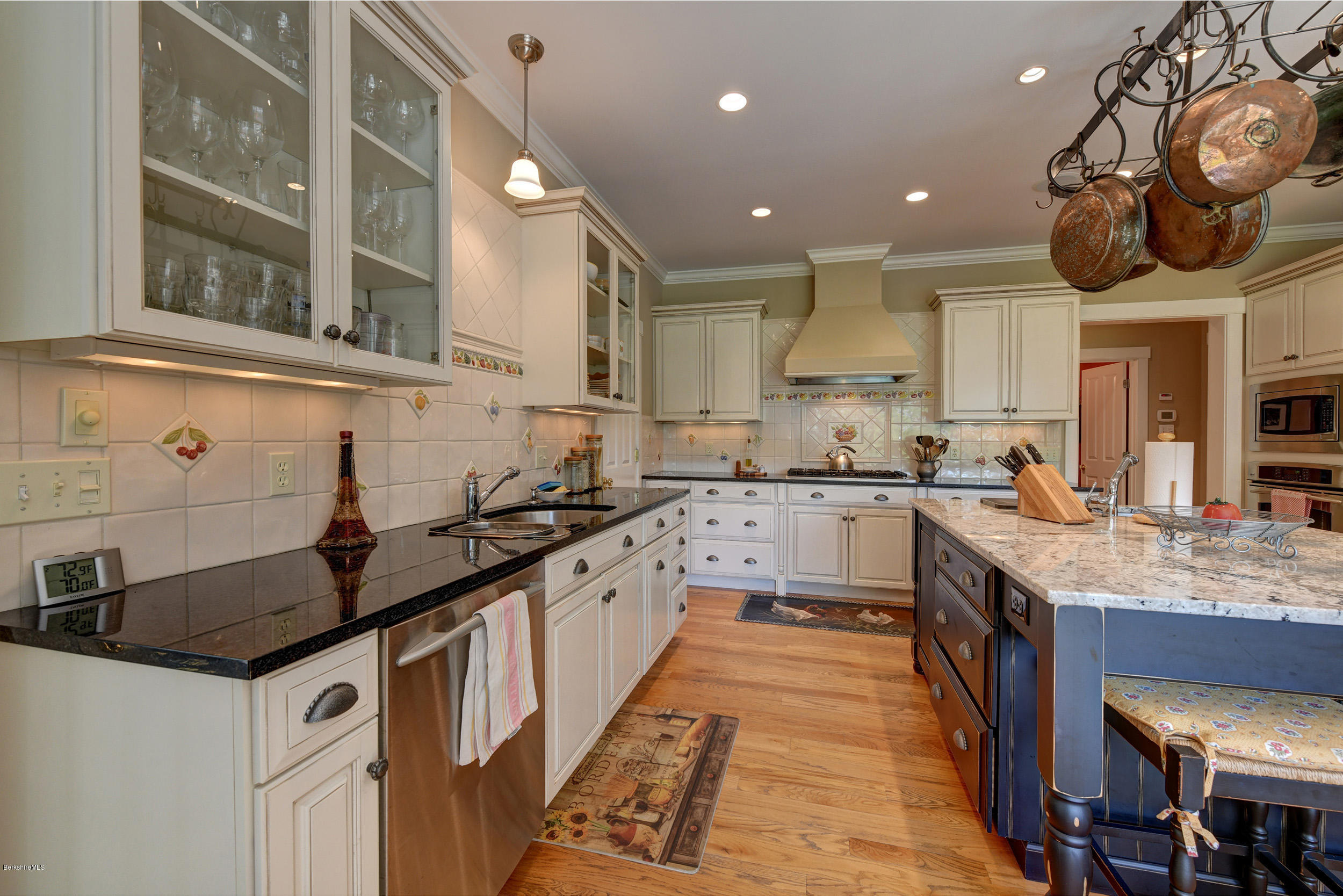 28 Austerlitz Road West Stockbridge, MA 01266 - Photo 3 of 44 a kitchen with granite countertop a sink a counter space cabinets and stainless steel appliances