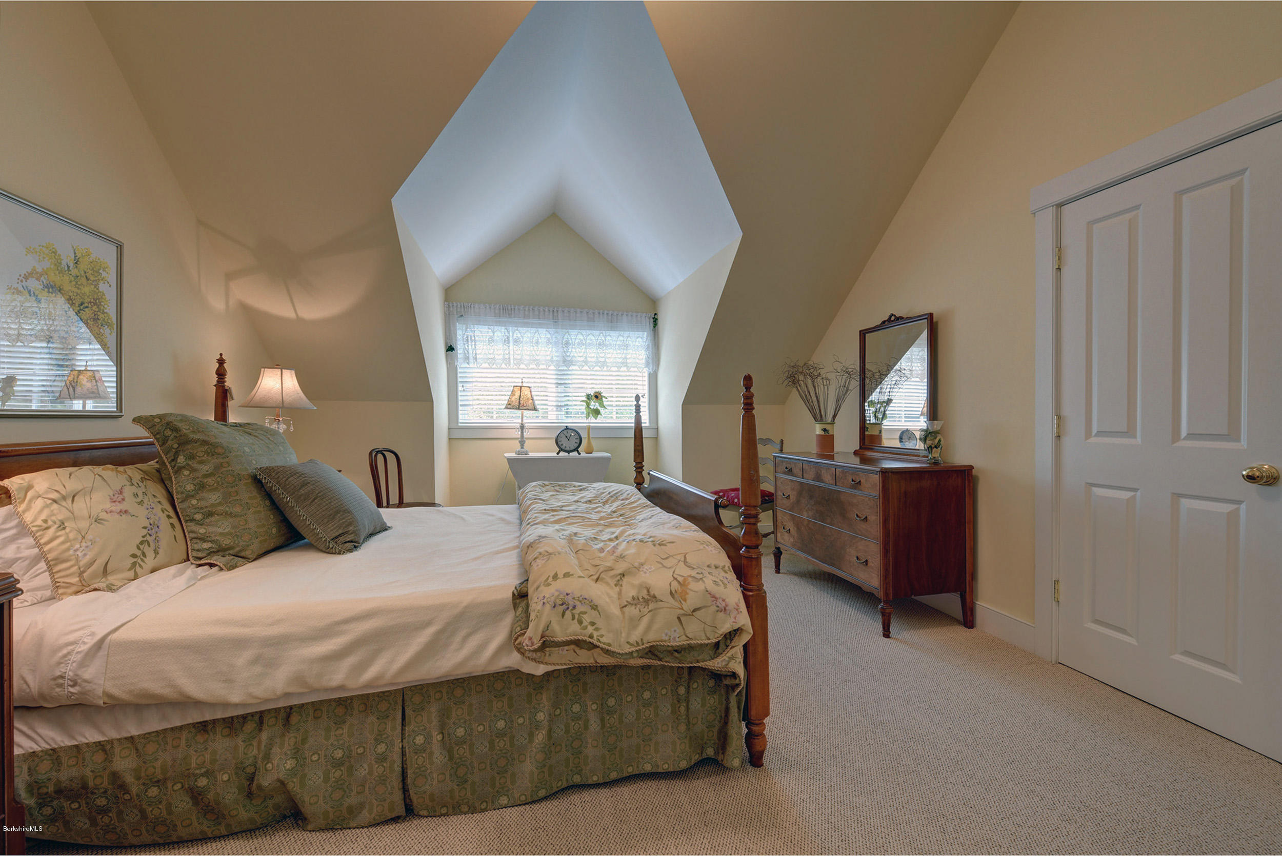 28 Austerlitz Road West Stockbridge, MA 01266 - Photo 22 of 44 a bedroom with a large bed and a chandelier