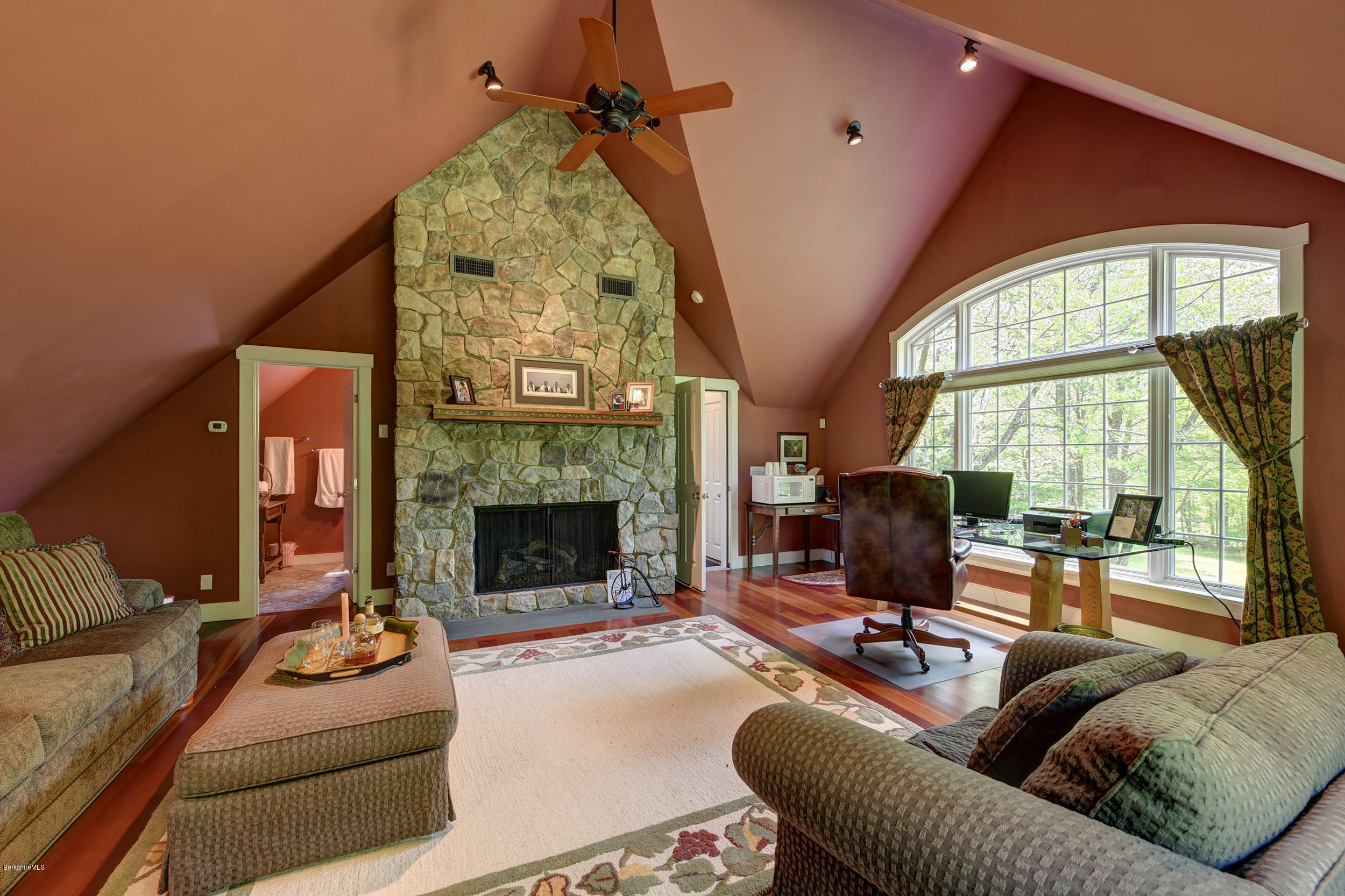 28 Austerlitz Road West Stockbridge, MA 01266 - Photo 29 of 44 a living room with furniture a fireplace and a floor to ceiling window