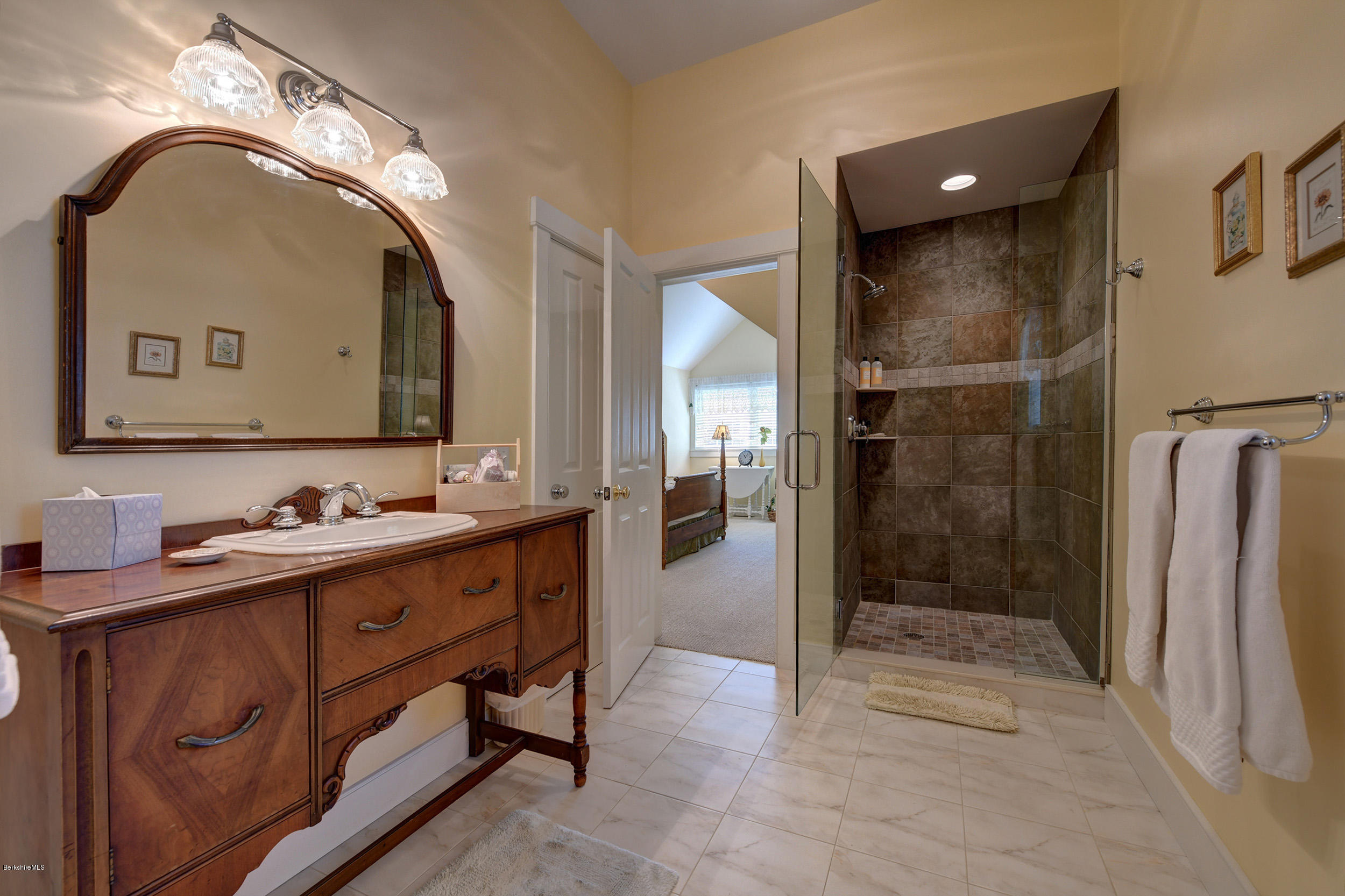 28 Austerlitz Road West Stockbridge, MA 01266 - Photo 30 of 44 a spacious bathroom with a double vanity sink and a mirror