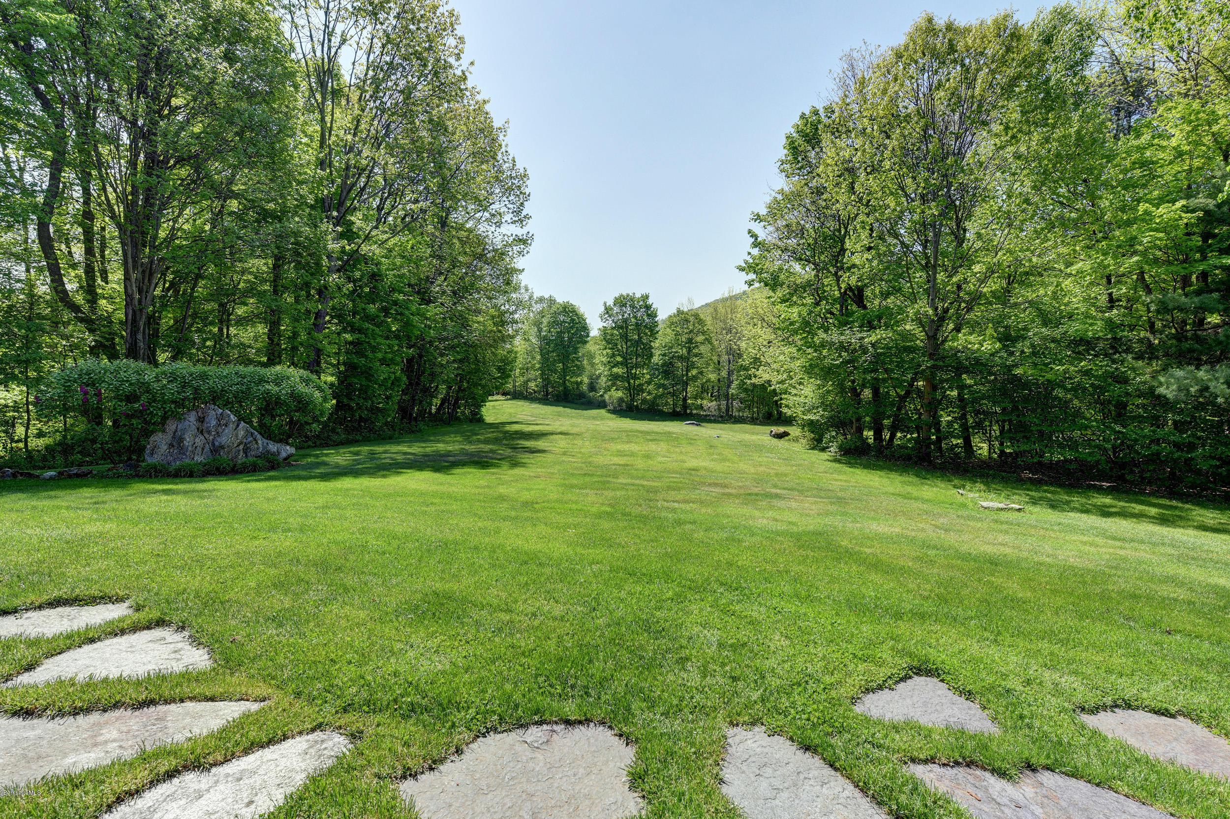 28 Austerlitz Road West Stockbridge, MA 01266 - Photo 38 of 44 a view of a grassy field with trees in the background