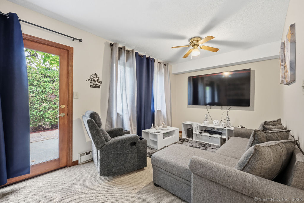 25 Washington Street, Unit 20 Bristol, CT 06010 - Photo 15 of 29 a living room with furniture and a flat screen tv