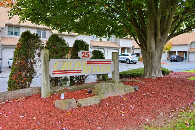 a view of hallway with furniture and a window