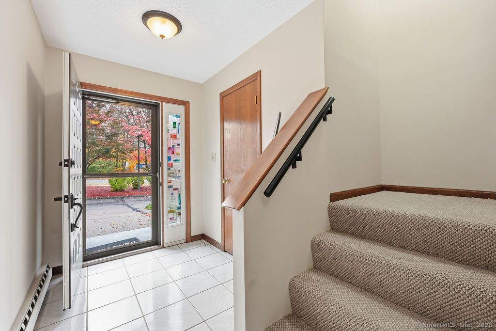 25 Washington Street, Unit 20 Bristol, CT 06010 - Photo 4 of 29 a view of hallway with furniture and a window