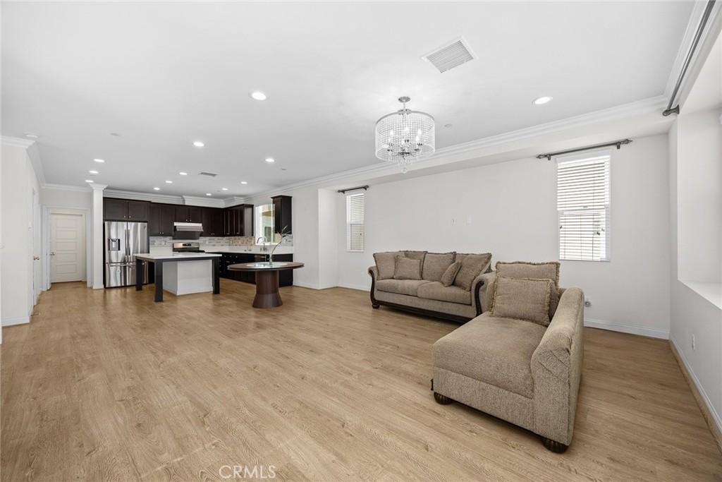3632 Jackson Baldwin Park, CA 91706 - Photo 11 of 24 a living room with furniture and kitchen view