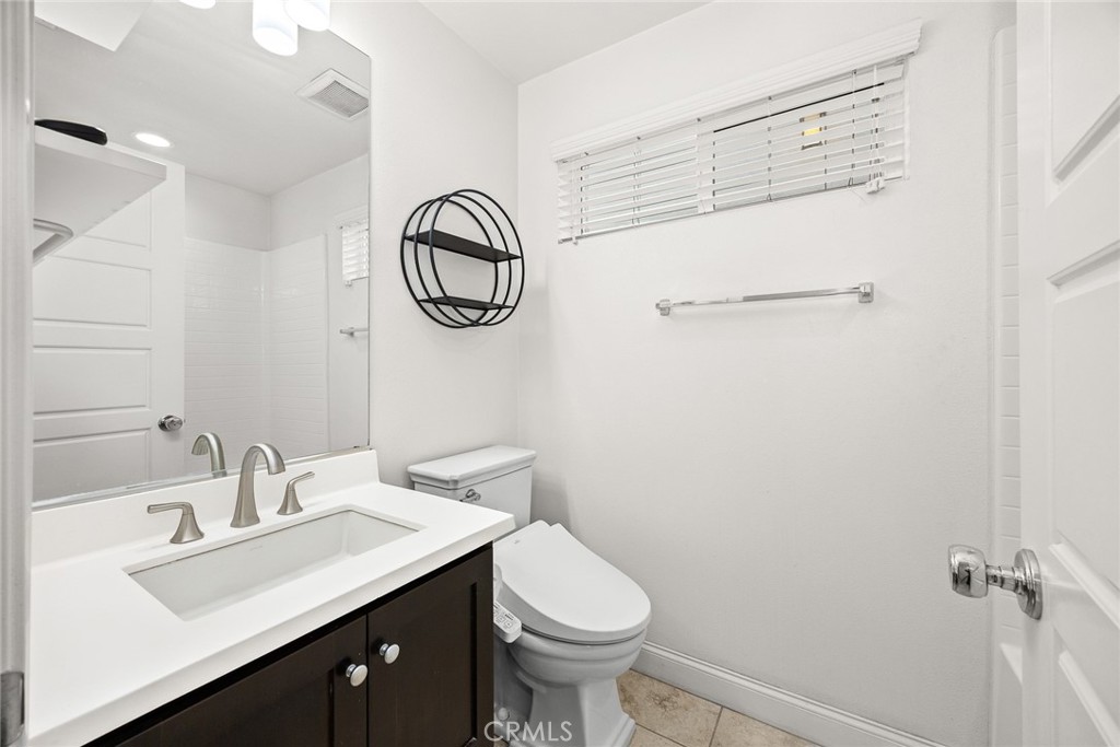 3632 Jackson Baldwin Park, CA 91706 - Photo 9 of 24 a bathroom with a sink toilet and a mirror