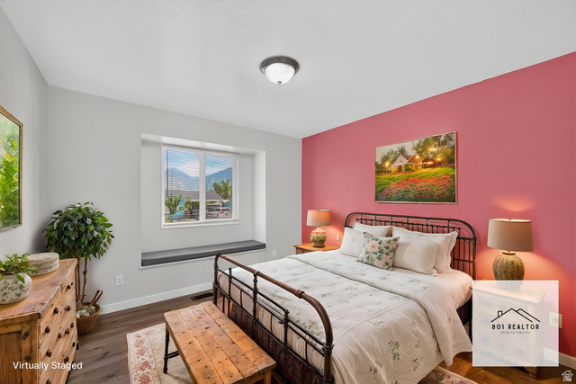 861 Wasatch Payson, UT 84651 - Photo 7 of 21 Bedroom featuring a window with integrated bench seating, wood-finish flooring, and a ceiling-mounted light fixture
