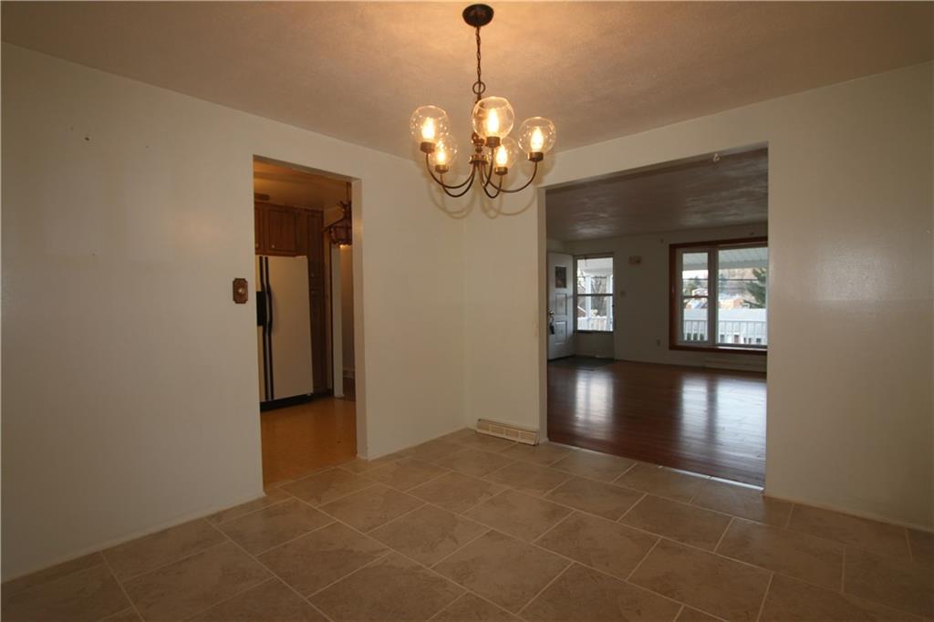 99 Fenway Road Pittsburgh, PA 15209 - Photo 8 of 19 The 12'x11' Dining Room opens to the Living Room on the right wall and the Kitchen on the left wall.porch.