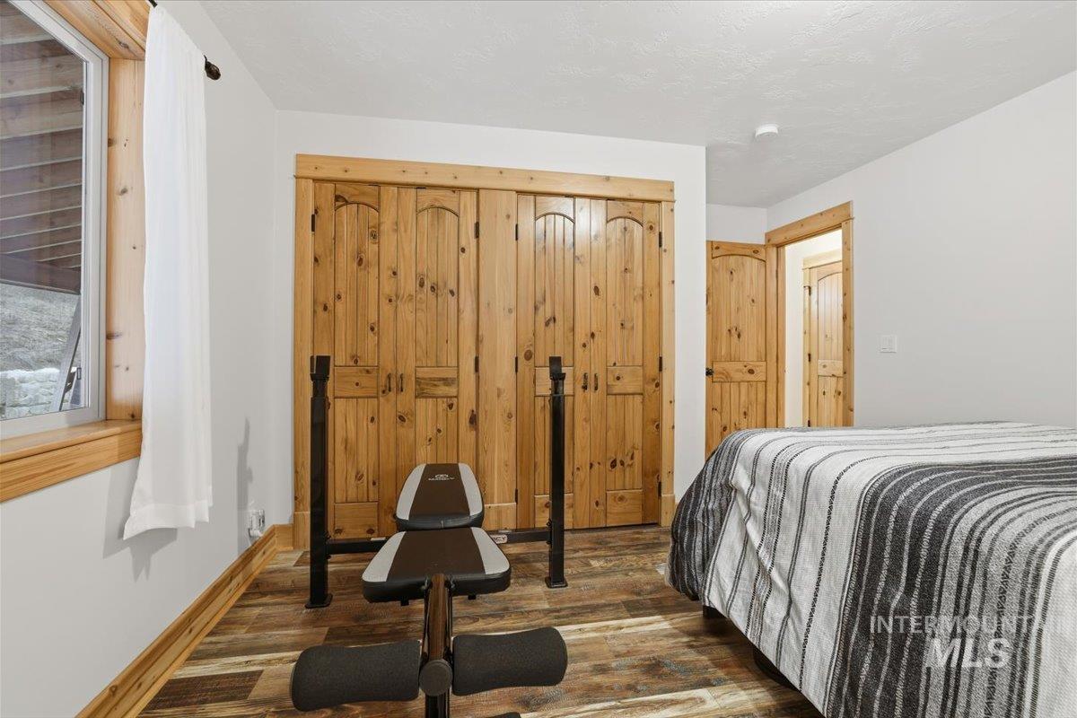 20 Valley High Road Garden Valley, ID 83622 - Photo 28 of 46 Bedroom featuring wood finished floors and a closet