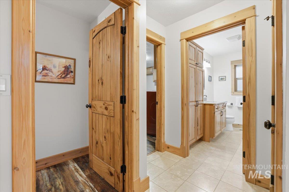 20 Valley High Road Garden Valley, ID 83622 - Photo 29 of 46 Hallway with baseboards and light wood finished floors