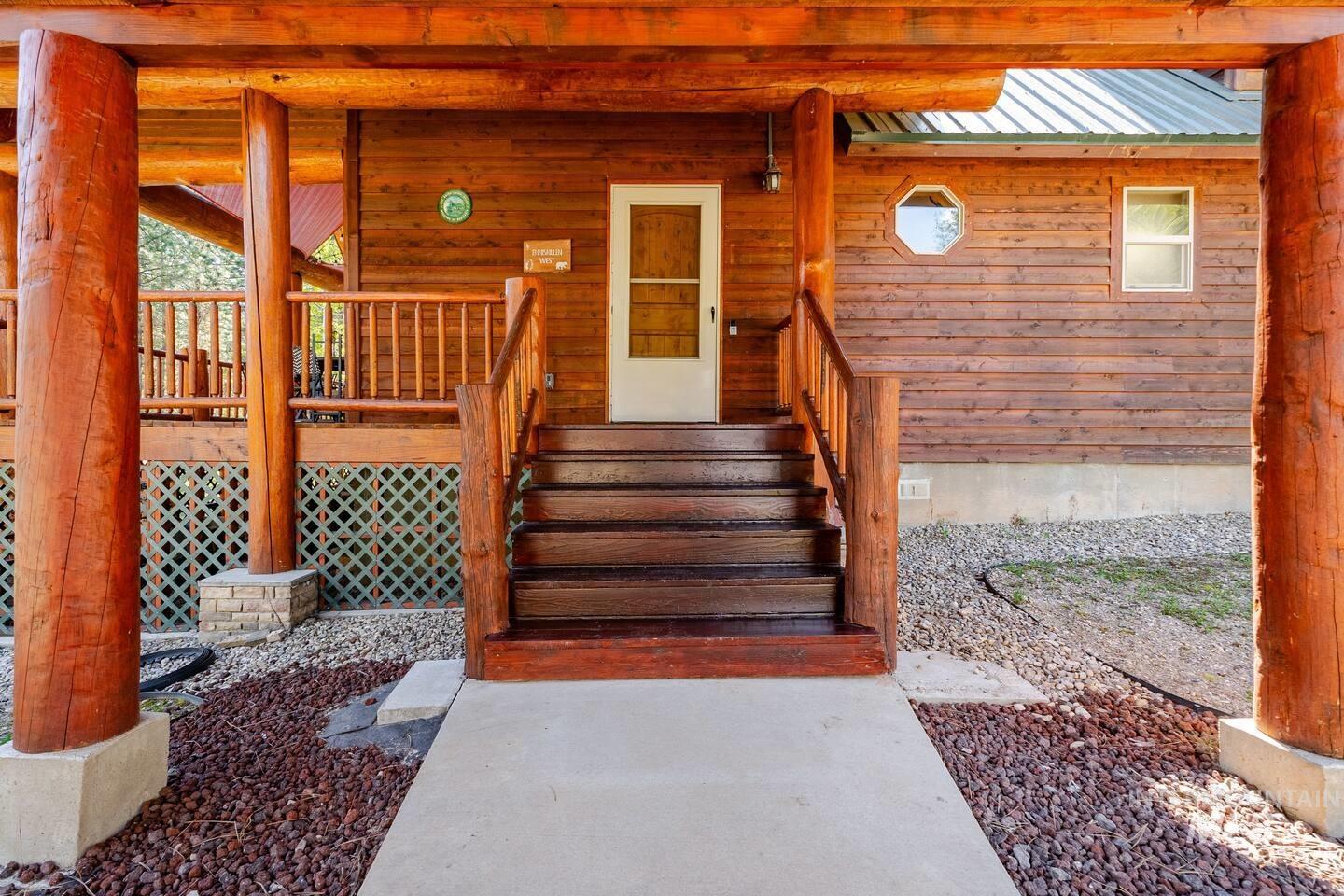 20 Valley High Road Garden Valley, ID 83622 - Photo 36 of 46 View of exterior entry with a metal roof and covered porch