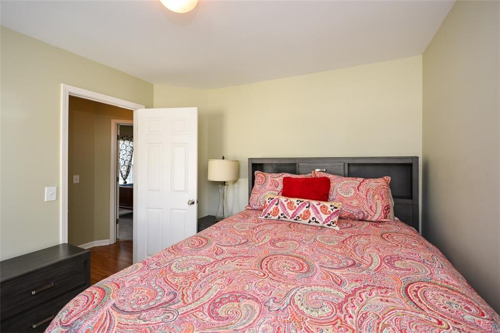 10 Arbor Hills Road South Talking Rock, GA 30175 - Photo 29 of 89 a bedroom with a large bed and wooden floor