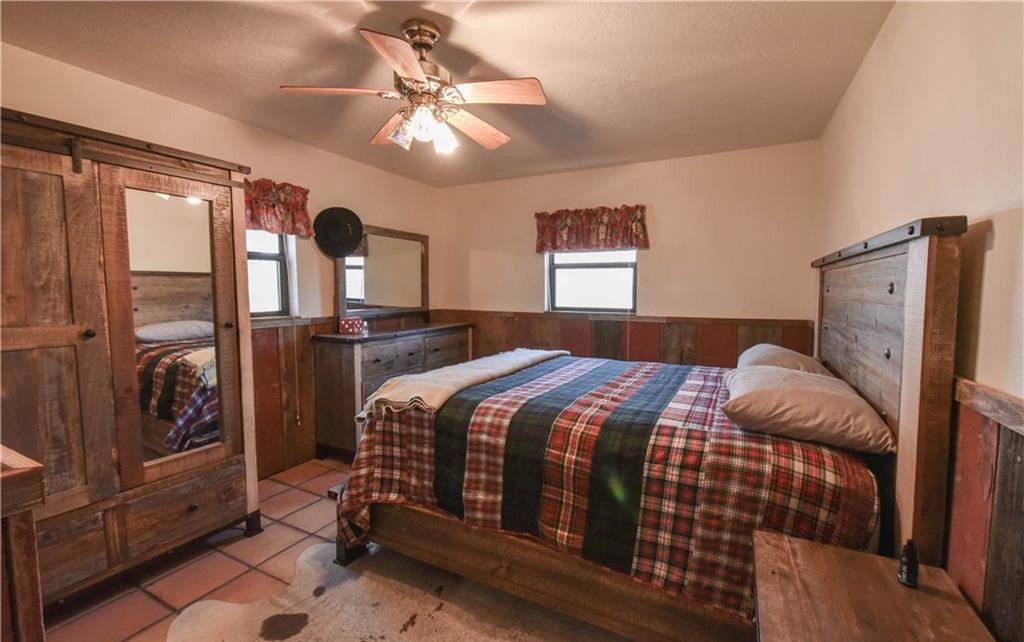 12200 Winn Road Franklin, TX 77856 - Photo 11 of 33 a bedroom with a bed and window
