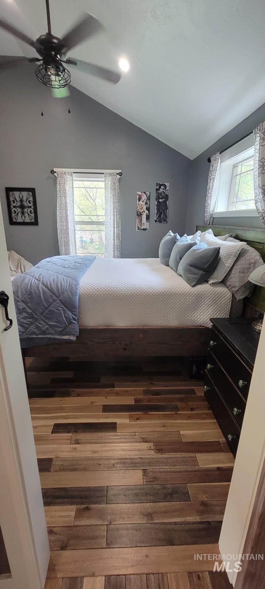 1006 Borah Avenue Riggins, ID 83549 - Photo 13 of 23 Bedroom with hardwood / wood-style floors, vaulted ceiling, multiple windows, a ceiling fan, and recessed lighting