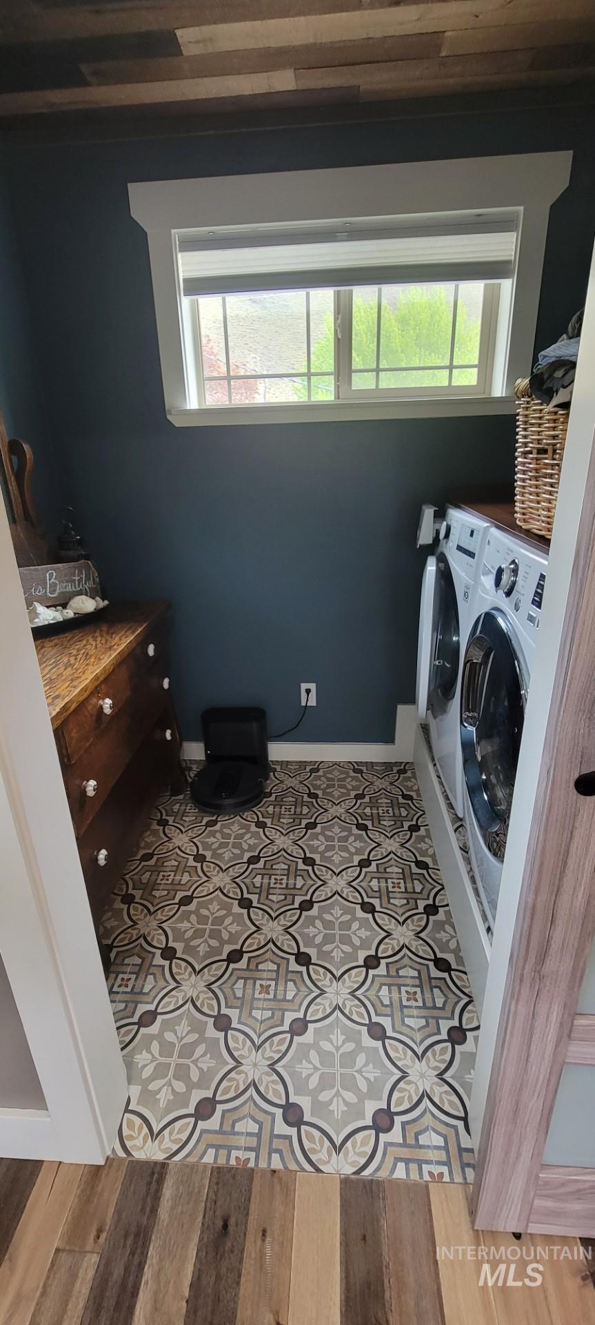 1006 Borah Avenue Riggins, ID 83549 - Photo 19 of 23 Laundry room with light wood-style floors and washer and clothes dryer