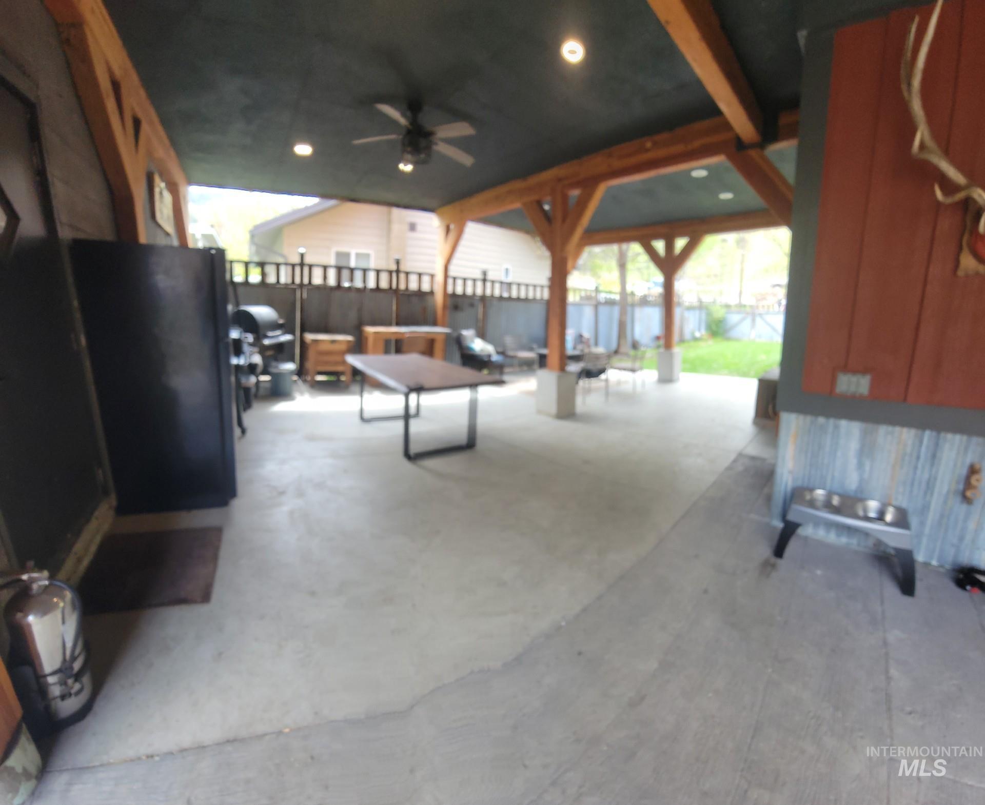 1006 Borah Avenue Riggins, ID 83549 - Photo 7 of 23 Fenced backyard with a patio area and a ceiling fan