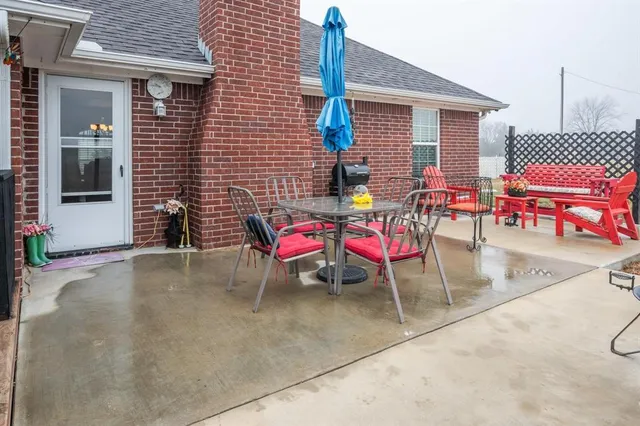 a view of a tables and chairs in patio