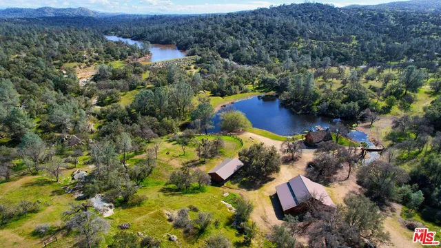 an aerial view of residential house with outdoor space