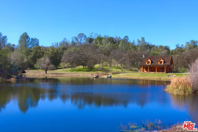 a view of a house with a big yard
