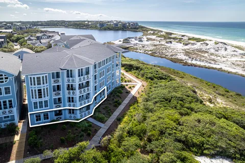 a view of a lake with a building and a big yard