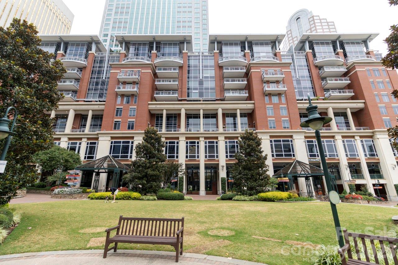 a front view of a building with a garden
