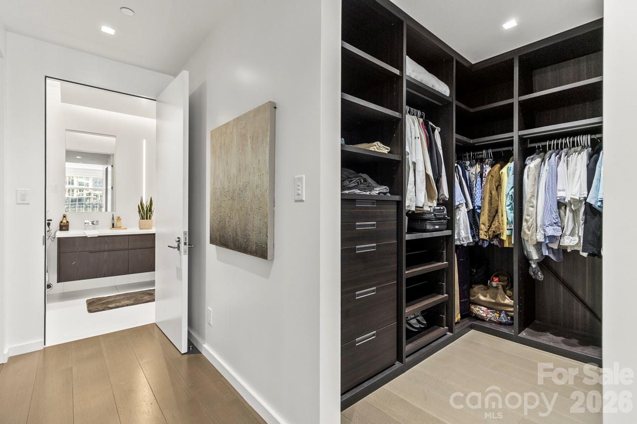 435 South Tryon Street, Unit 901 Charlotte, NC 28202 - Photo 28 of 28 a view of walk in closet and bedroom