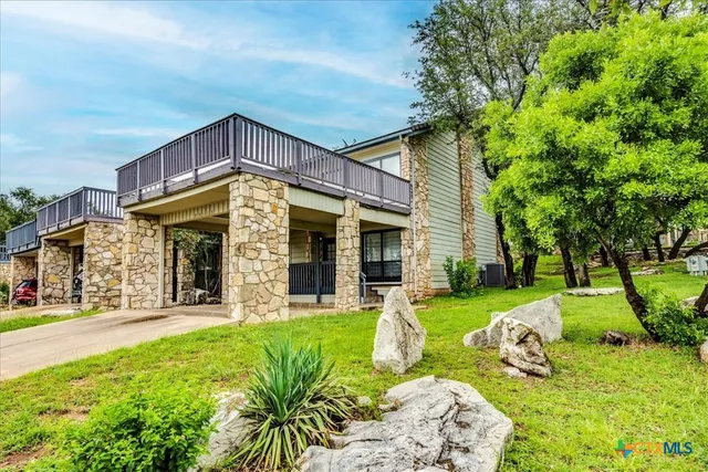 a view of a house with garden and porch