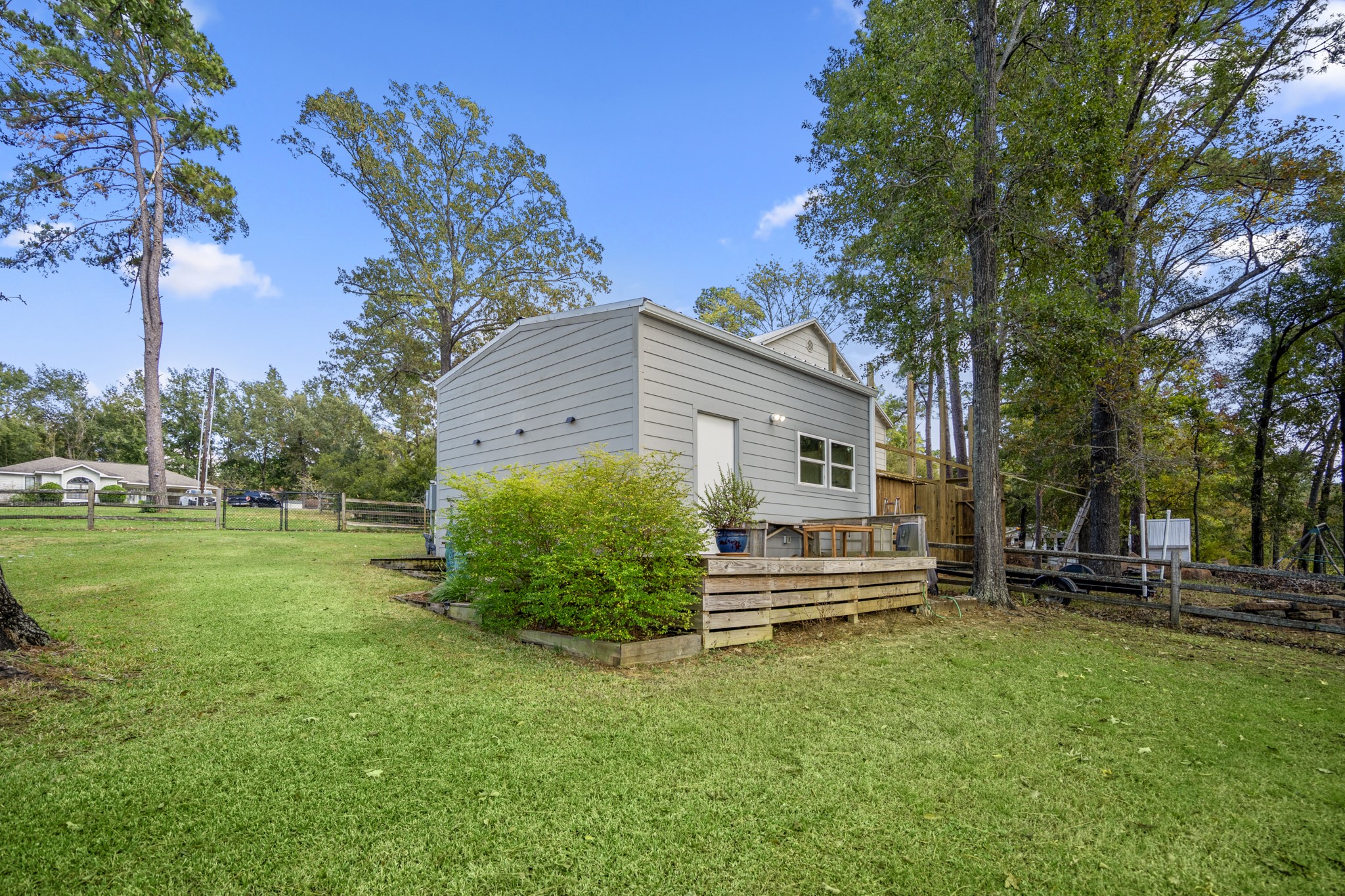 615 Inlet Drive Livingston, TX 77351 - Photo 39 of 50 This outdoor workshop offers versatility while blending perfectly into the wooded landscape.