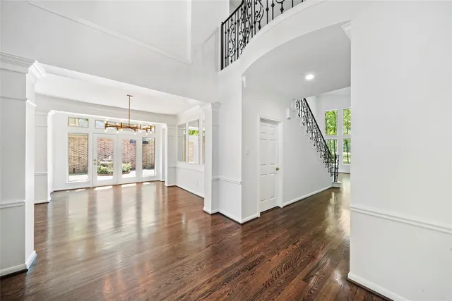 a view of an entryway with wooden floor