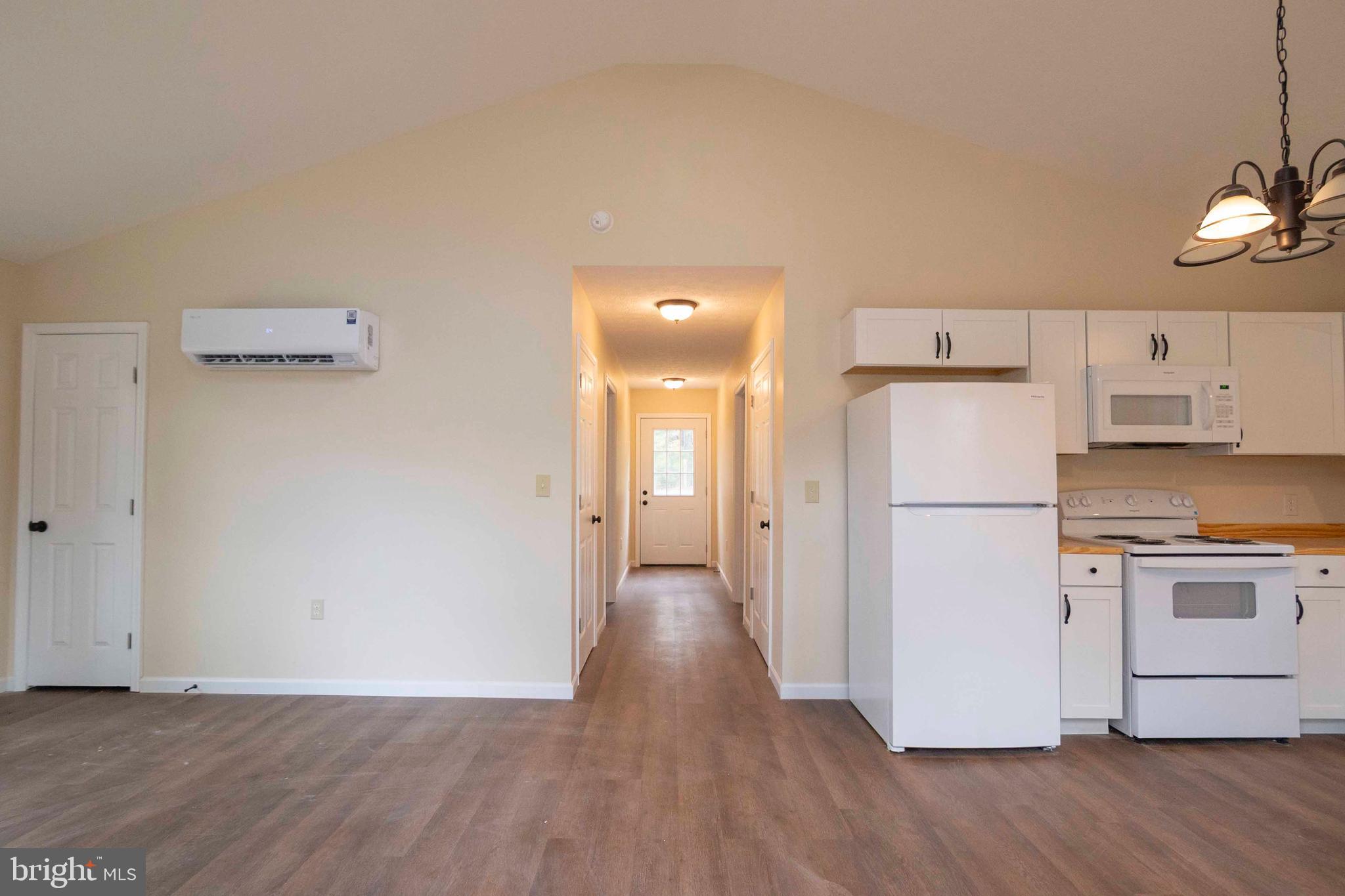 161 Ridge Loop Luray, VA 22835 - Photo 13 of 30 a view of a kitchen with a white cabinet and a stove top oven