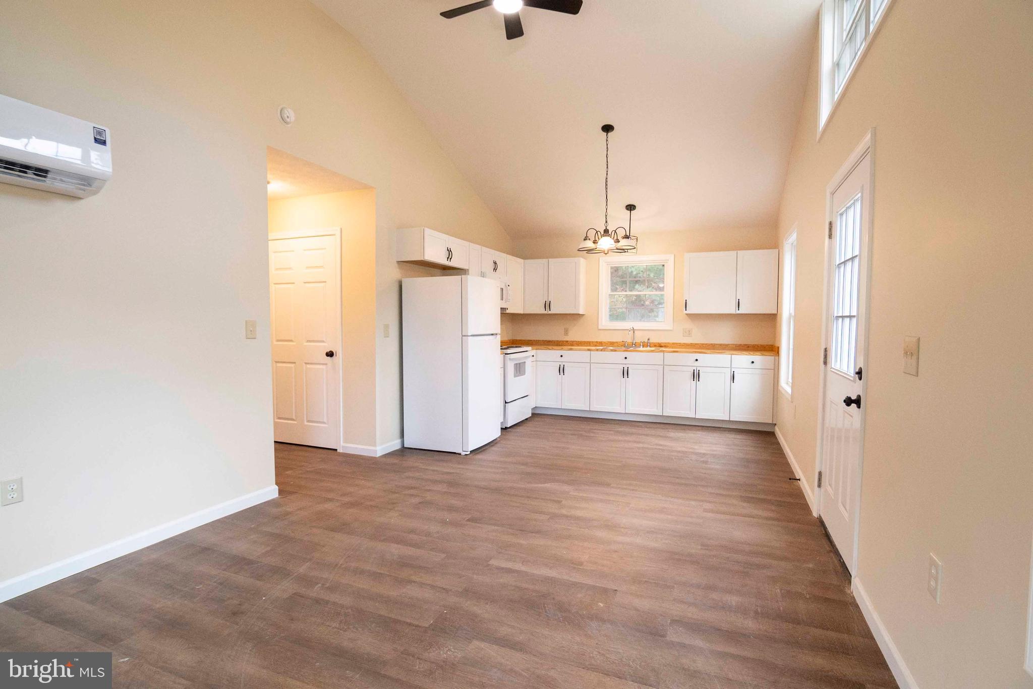 161 Ridge Loop Luray, VA 22835 - Photo 14 of 30 a view of a kitchen with a sink and dishwasher a refrigerator with wooden floor