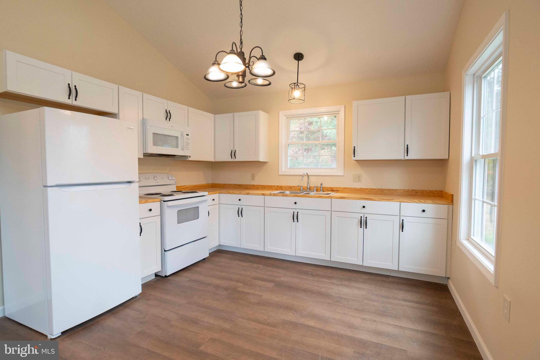 161 Ridge Loop Luray, VA 22835 - Photo 15 of 30 a kitchen with granite countertop white cabinets and white appliances