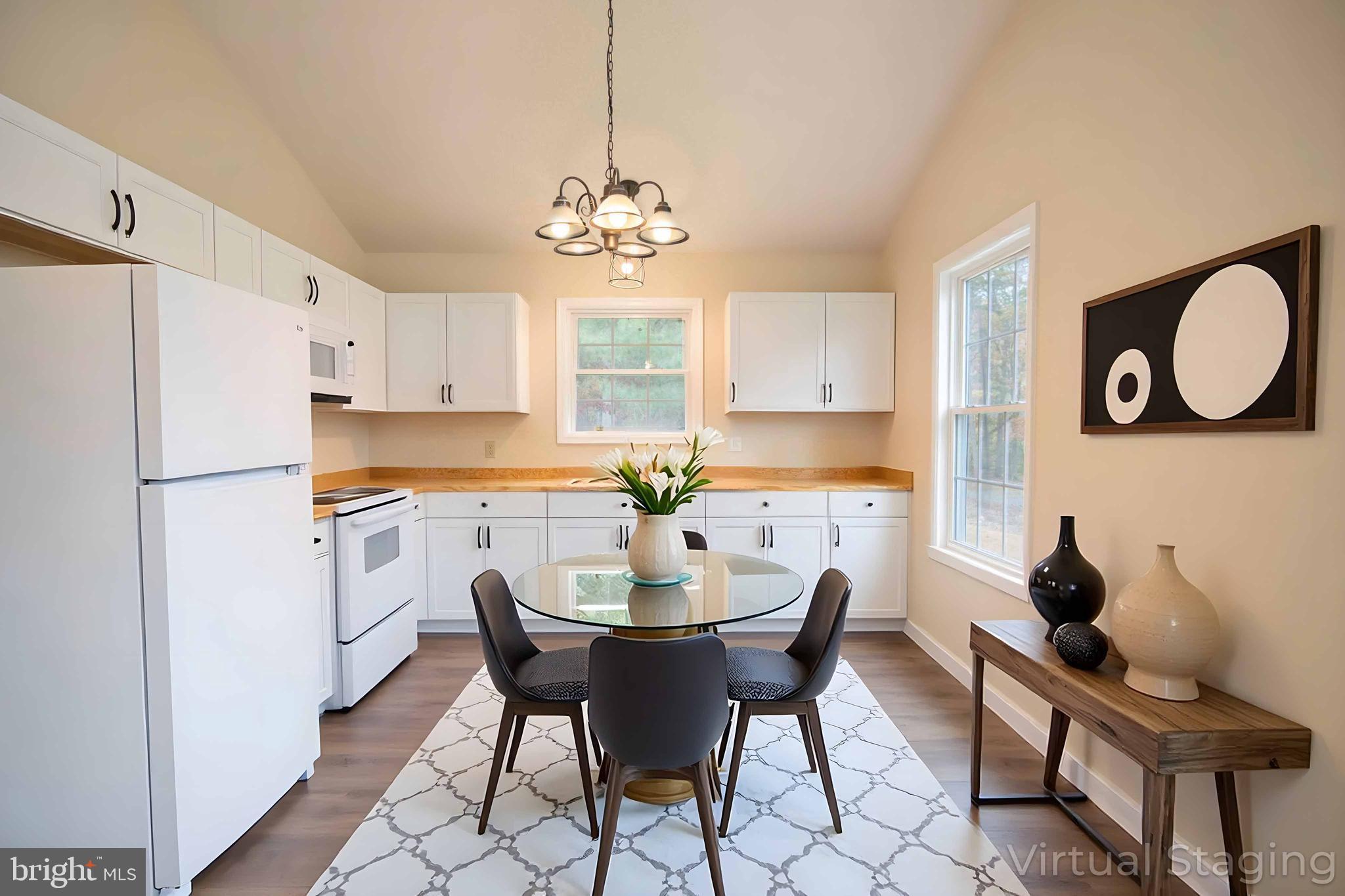 161 Ridge Loop Luray, VA 22835 - Photo 6 of 30 a view of a dining room with furniture a kitchen and chandelier