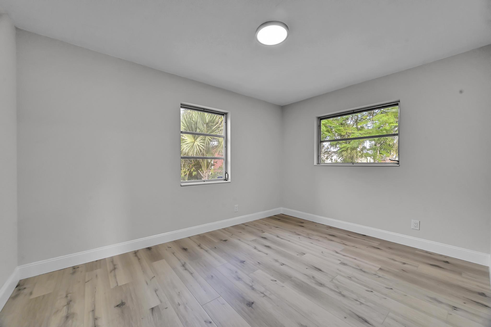 8487 Southeast Begonia Way Hobe Sound, FL 33455 - Photo 20 of 26 an empty room with windows