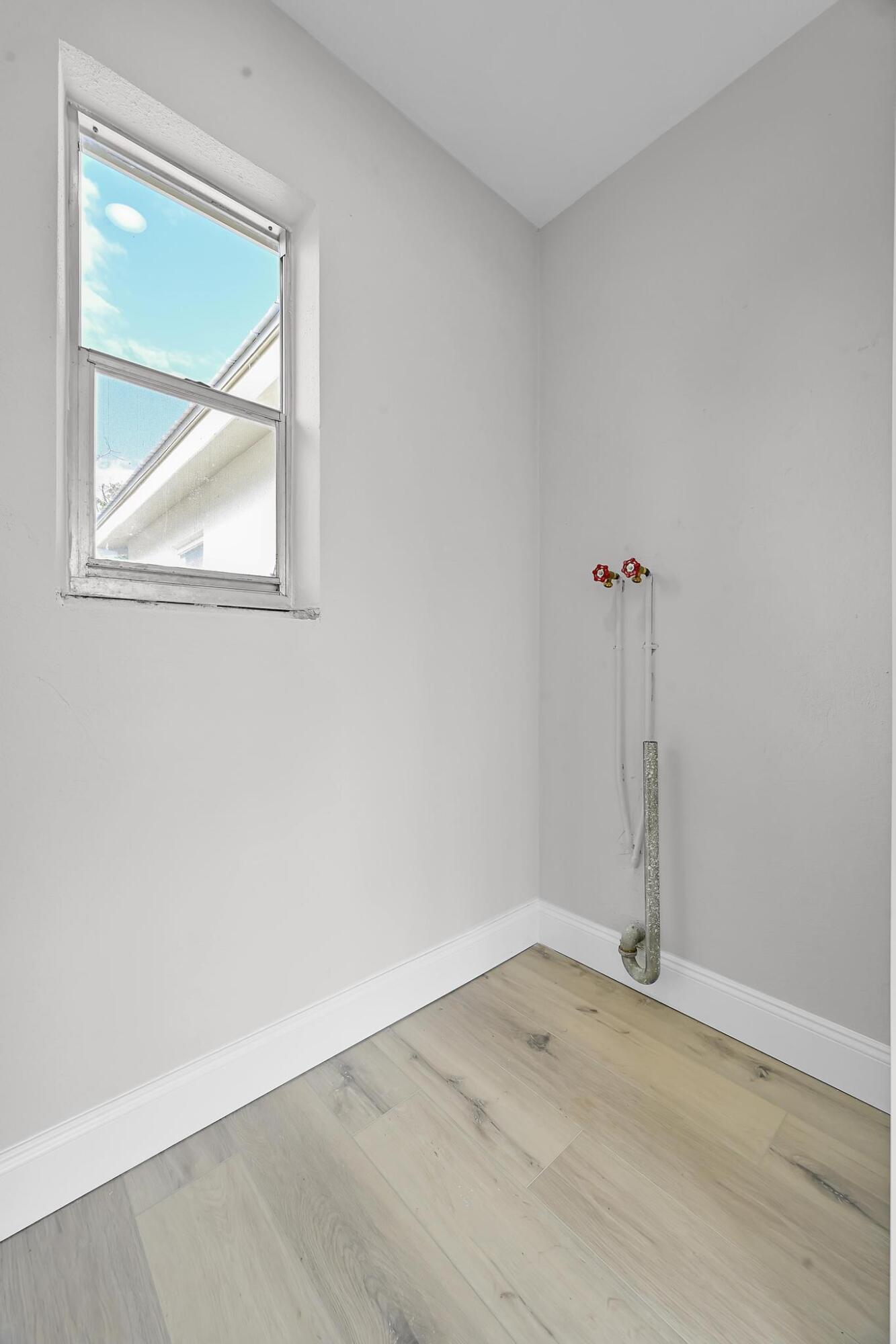 8487 Southeast Begonia Way Hobe Sound, FL 33455 - Photo 23 of 26 an empty room with a window