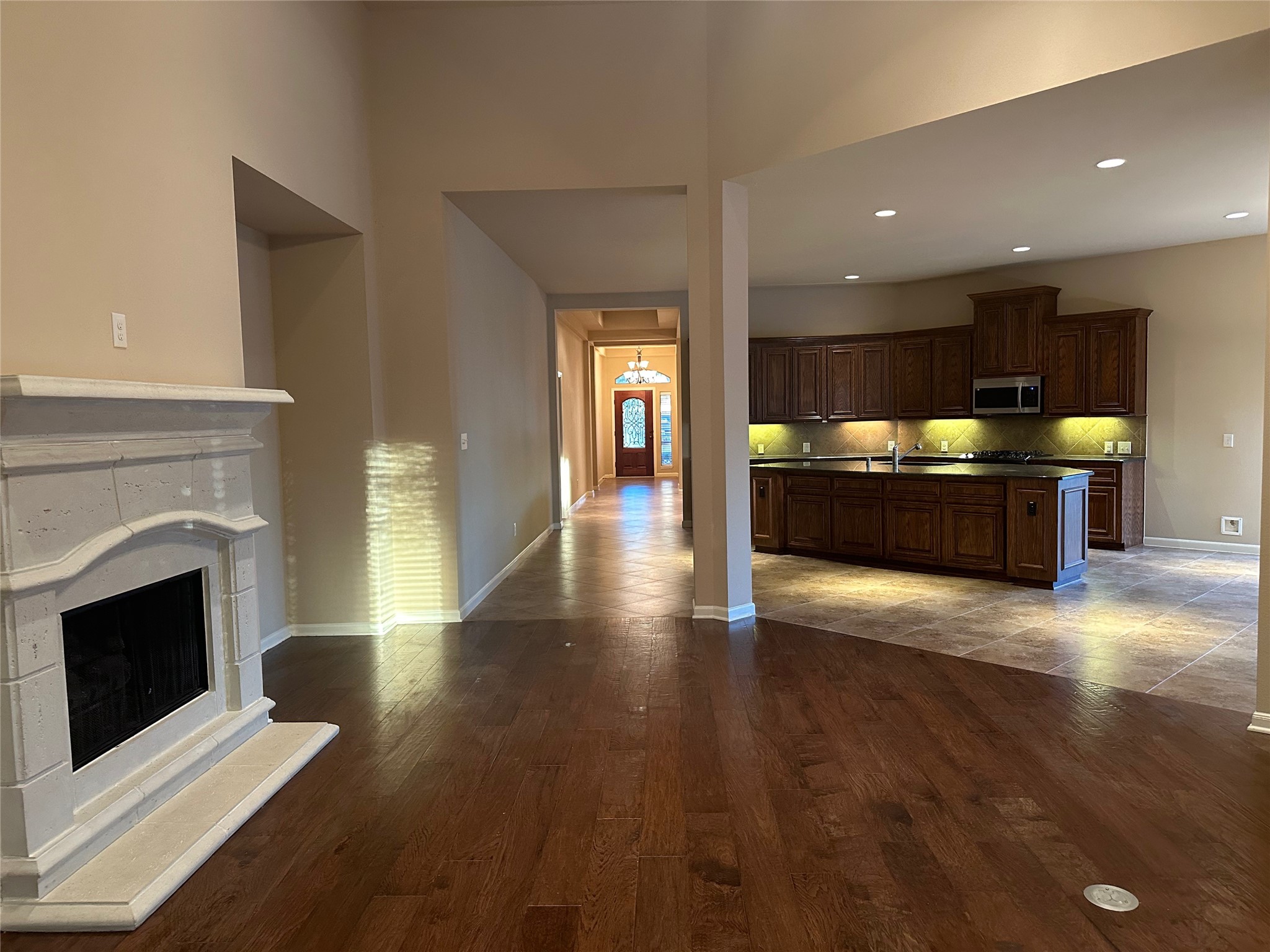 2922 Firewalk Trace Katy, TX 77494 - Photo 38 of 38 a view of a living room with wooden floor and a fireplace