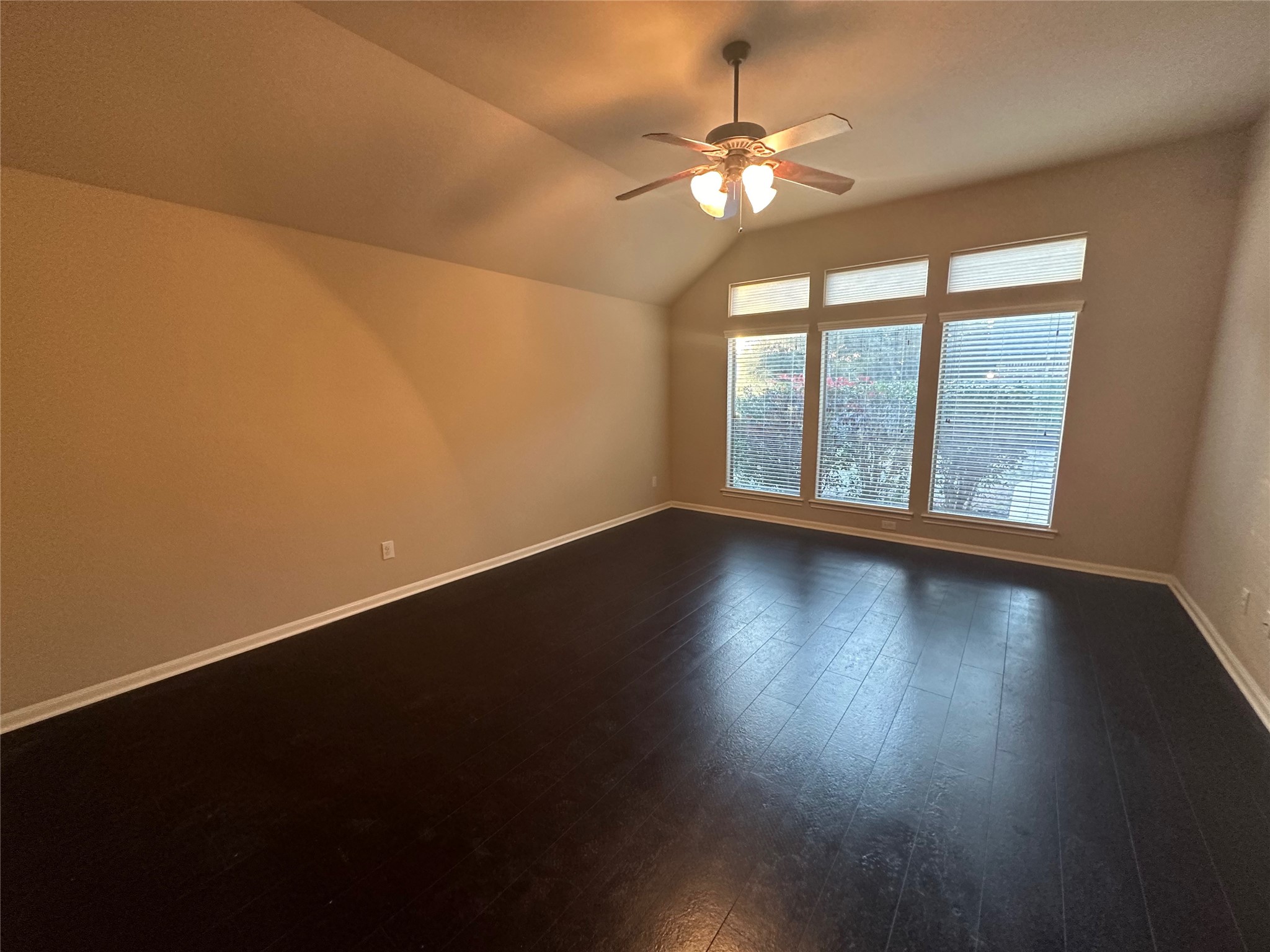 2922 Firewalk Trace Katy, TX 77494 - Photo 18 of 38 an empty room with wooden floor and windows