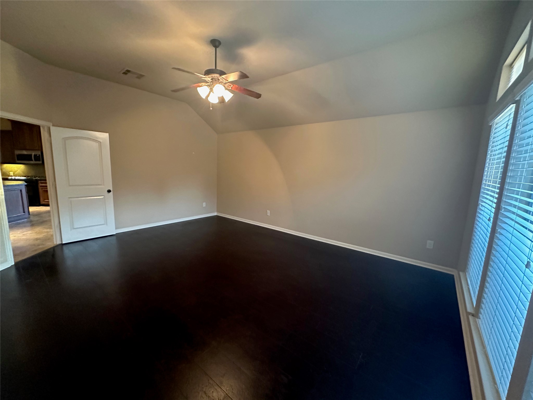 2922 Firewalk Trace Katy, TX 77494 - Photo 19 of 38 a view of a room with wooden floor and fan