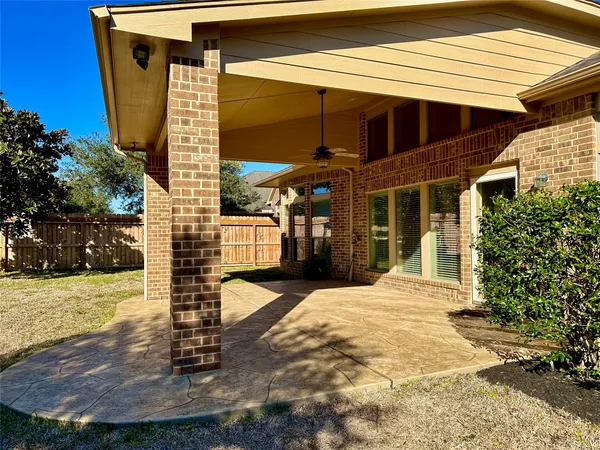 a view of a house with brick walls