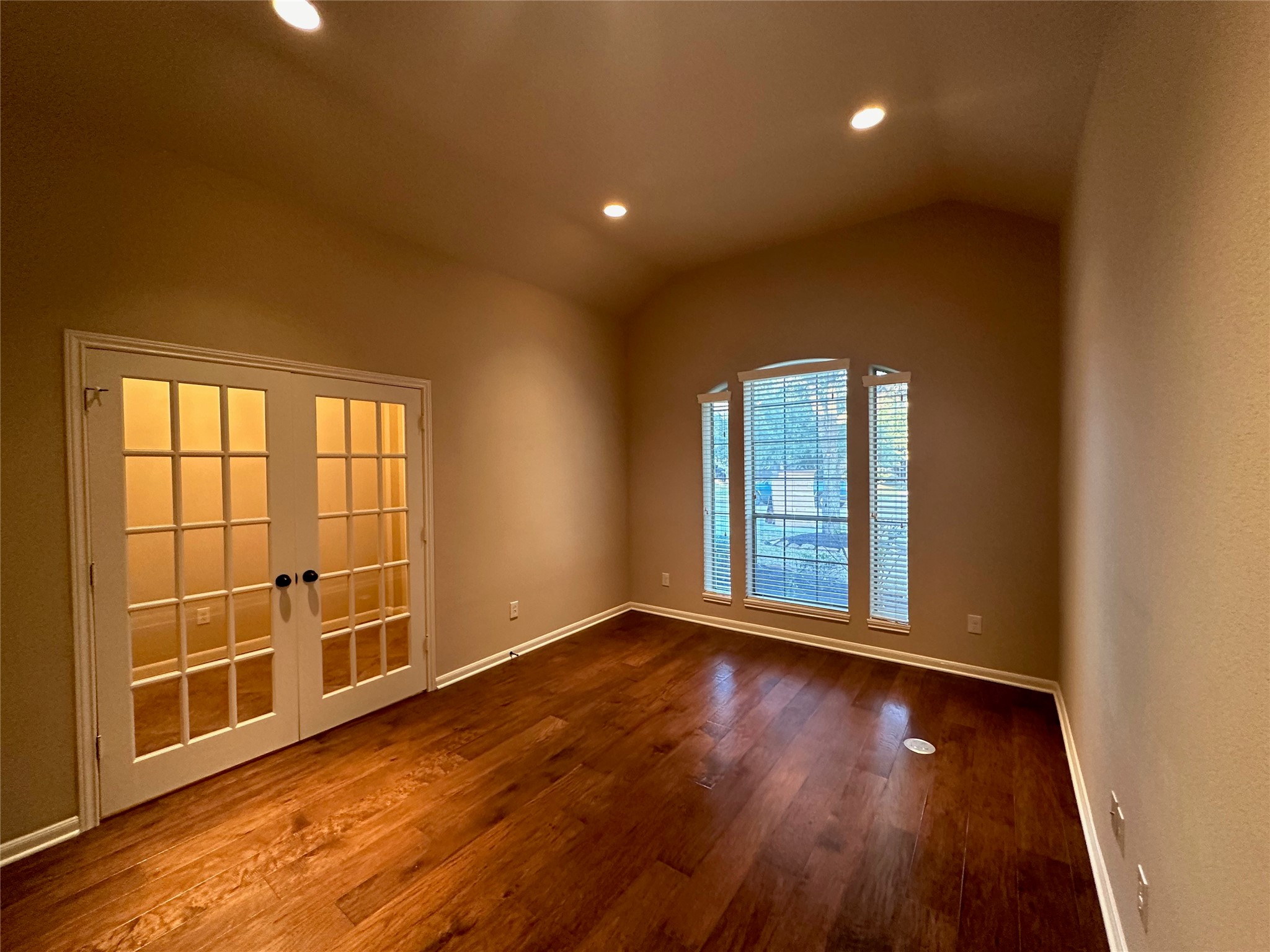 2922 Firewalk Trace Katy, TX 77494 - Photo 6 of 38 a view of an empty room with wooden floor and a window