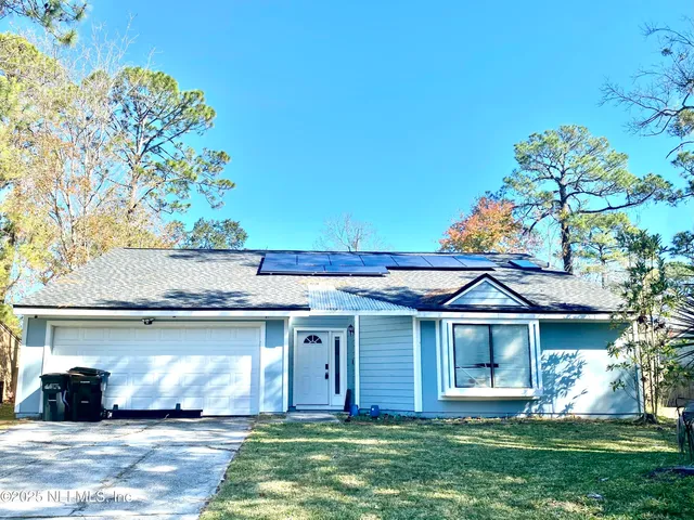 front view of a house with a yard