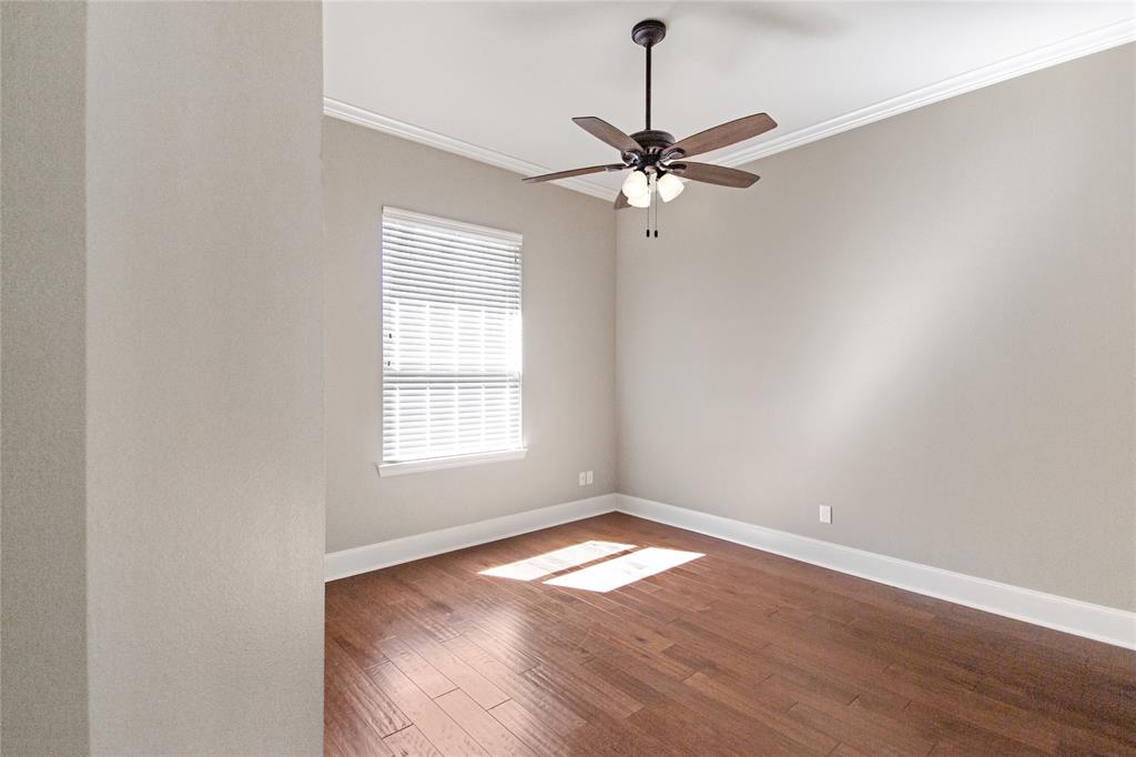 15207 Maple Leaf Court Tyler, TX 75707 - Photo 11 of 29 an empty room with wooden floor fan and windows