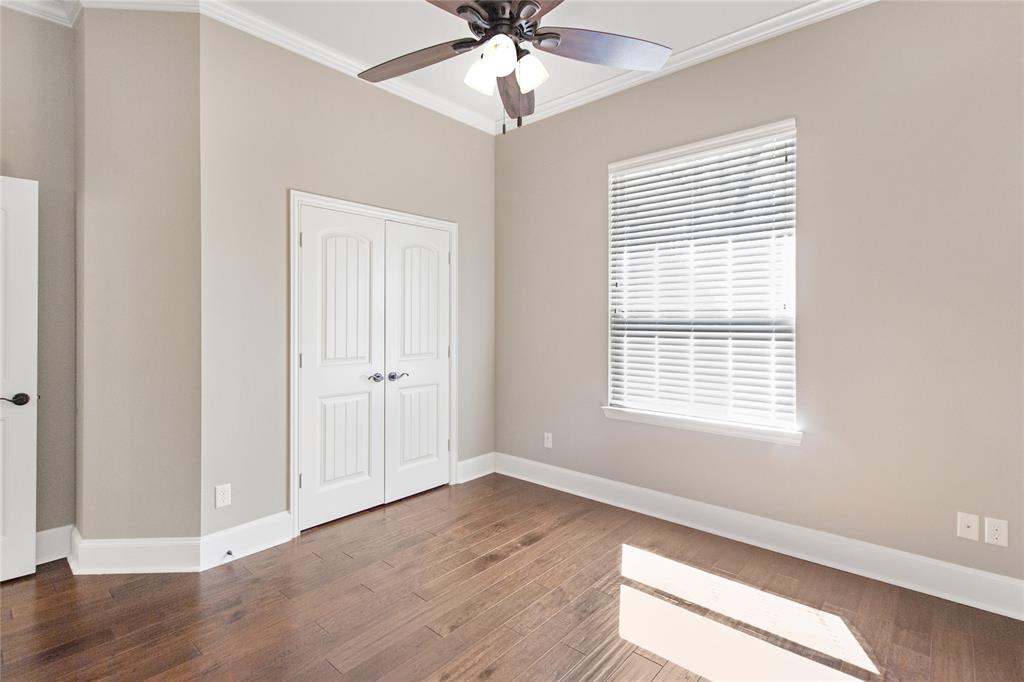 15207 Maple Leaf Court Tyler, TX 75707 - Photo 12 of 29 a view of an empty room with wooden floor and a window