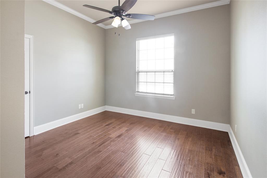 15207 Maple Leaf Court Tyler, TX 75707 - Photo 16 of 29 an empty room with wooden floor fan and windows