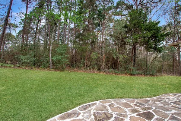 a backyard of a house with lots of green space