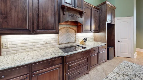a kitchen with a sink and a refrigerator