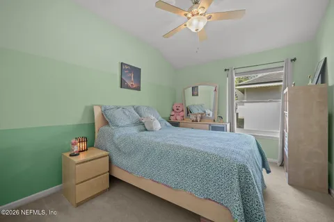 a bed room with a bed and a chandelier