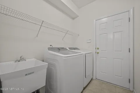 a utility room with dryer and washer