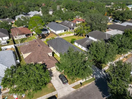 an aerial view of residential house with outdoor space and street view