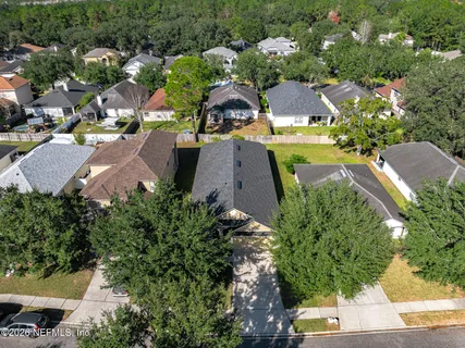an aerial view of a house with a garden